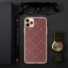 Crimson Cross Stitch Clear Case for iPhone — repeating white cross stitch X marks and diagonal dashes arranged in a grid