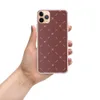 Crimson Cross Stitch Clear Case for iPhone — repeating white cross stitch X marks and diagonal dashes arranged in a grid