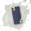 Navy Quilted Diamond Clear Case for iPhone — diagonal navy quilted diamond grid with white dashed stitch lines and small