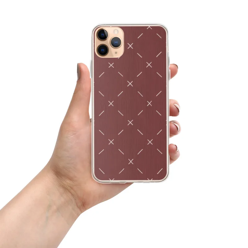 Crimson Cross Stitch Clear Case for iPhone — repeating white cross-stitch X marks and diagonal lines on a rich burgundy-red