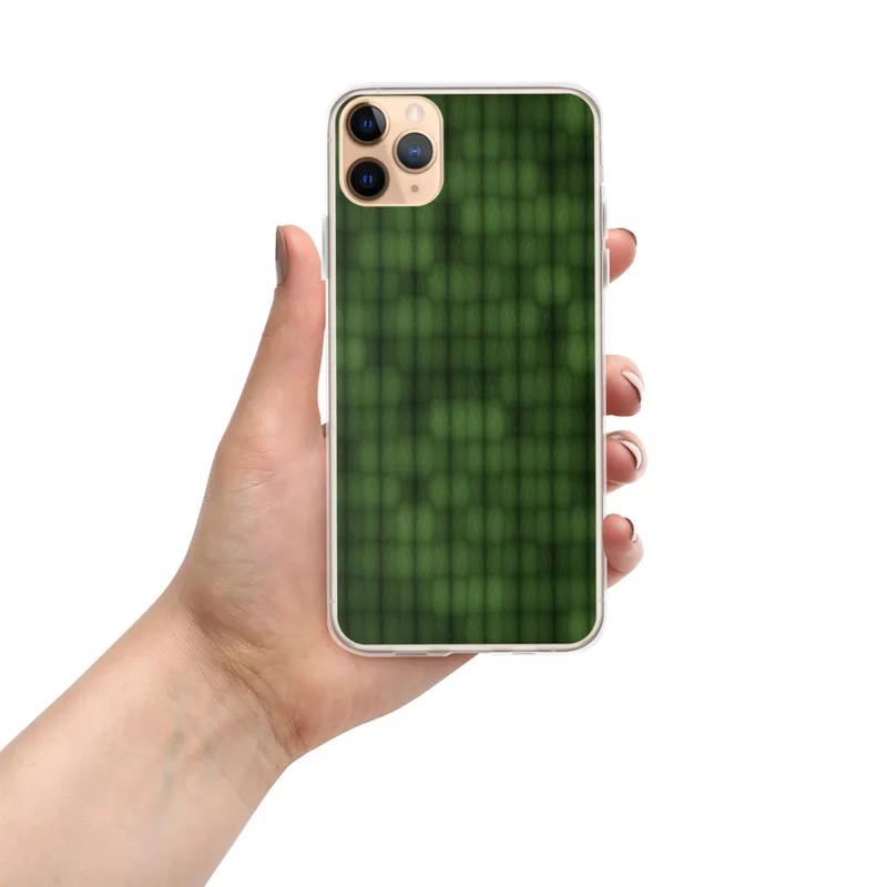 repeating grid of deep olive and emerald green textured cells with a faint skull silhouette emerging from the pattern