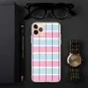 Pastel Plaid Clear Case for iPhone — pastel pink, sky blue, pale yellow, and white tartan plaid with bold magenta and purple