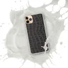 Dark Croc Skin Clear Case for iPhone — close-up black crocodile skin scale pattern with deep charcoal tones and raised gray