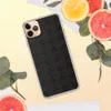 Dark Stone Grid Clear Case for iPhone — repeating charcoal cobblestone grid with beveled tiles and ornate cross junctions