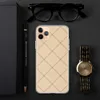 Golden Lattice Clear Case for iPhone — diagonal grid of warm beige square tiles with fine dark lines and small cross accents