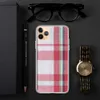 Holiday Plaid Clear Case for iPhone — traditional madras-style plaid in crimson red, forest green, deep navy, and white