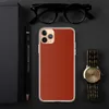 Crimson Ember Clear Case for iPhone — deep crimson red surface with a subtle crackled lacquer texture pattern in tonal dark