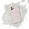 Red Plaid Clear Case for iPhone — red windowpane plaid grid on a white woven textile background with evenly spaced checks