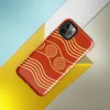 Glossy Golden Waves Ancient Spiral Tough Case for iPhone — gold concentric spirals and undulating wave bands on a deep