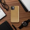 Glossy Golden Warmth Minimalist Tough Case for iPhone — smooth brushed golden amber surface with subtle tonal texture