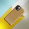 Glossy Golden Sand Texture Tough Case for iPhone — worn golden ochre painted surface with subtle brush strokes and scattered