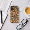Glossy Circuit Camo Tech Fortress Tough Case for iPhone — dense camouflage pattern of orange and charcoal mechanical circuit