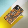 Glossy Circuit Camo Tech Fortress Tough Case for iPhone — dense camouflage pattern of orange and charcoal mechanical circuit