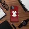 Glossy Jingle Bells Holiday Tough Case for iPhone — three white Christmas bells with ribbon bows arranged in a row on a deep