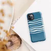 Glossy Ocean Wave Lines Tough Case for iPhone — fluid white wavy horizontal lines layered across a rich teal blue background