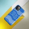 Glossy Ocean Waves Blue Tide Tough Case for iPhone — white flowing wave lines and spiral scroll crests repeating across