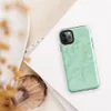 Glossy Mint Crystal Geometric Tough Case for iPhone — low-poly geometric triangles in soft mint, sage, seafoam, and pale