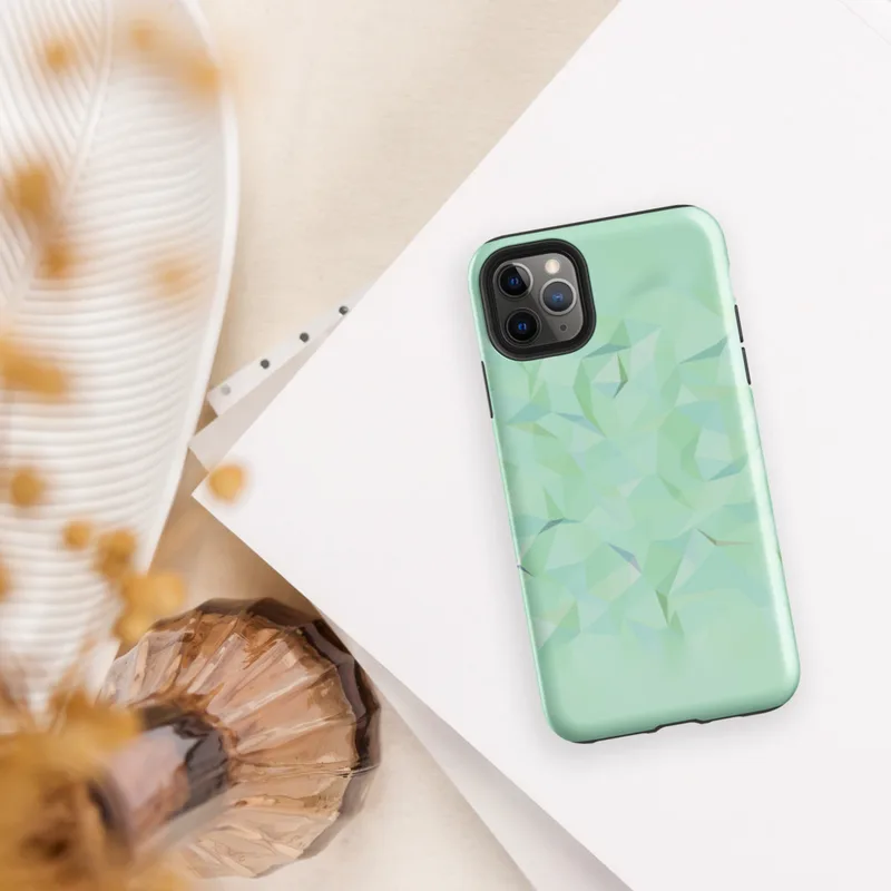 Glossy Mint Crystal Geometric Tough Case for iPhone — low-poly geometric triangles in soft mint, sage, seafoam, and pale
