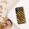 Glossy Rusted Hazard Zone Tough Case for iPhone — weathered rust-brown metal surface covered in diagonal yellow and black