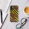 Glossy Rusted Hazard Zone Tough Case for iPhone — weathered rust-brown metal surface covered in diagonal yellow and black