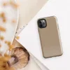 Glossy Warm Sand Minimal Tough Case for iPhone — smooth warm sand beige surface with subtle light speckles and soft tonal