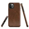 Glossy Rust and Iron Shield Tough Case for iPhone — photorealistic weathered rust metal surface with deep burnt sienna, dark