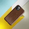 Glossy Rust and Iron Shield Tough Case for iPhone — photorealistic weathered rust metal surface with deep burnt sienna, dark