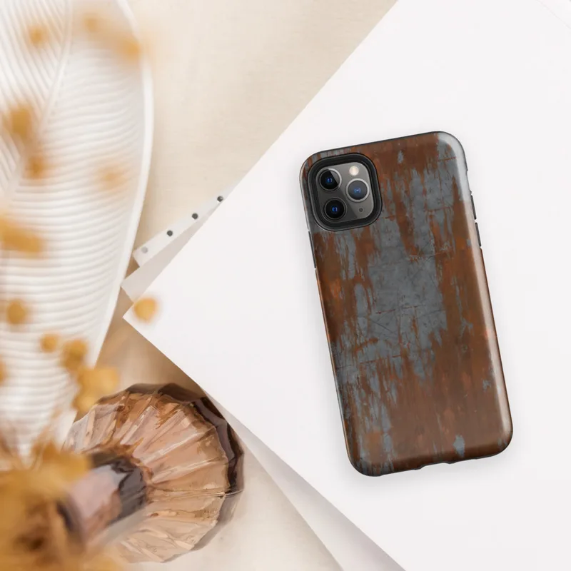 Glossy Iron Decay Rust Metal Tough Case for iPhone — heavily rusted steel surface with streaks of burnt sienna and orange
