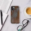 Glossy Iron Decay Rust Metal Tough Case for iPhone — heavily rusted steel surface with streaks of burnt sienna and orange