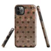 Glossy Industrial Rust Perforated Metal Tough Case for iPhone — close-up of heavily rusted perforated steel plate with rows