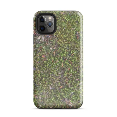 aerial close-up photograph of vivid green moss covering forest ground with scattered pine needles, bark chips, and small stones in earthy tones on Glossy Forest Floor Moss Texture Case - default view