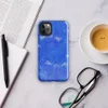 Glossy Electric Blue Splatter Storm Tough Case for iPhone — vivid cobalt blue textured surface covered in scattered white