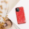 Glossy Red Chaos Splatter Tough Case for iPhone — explosive red background covered in silver-gray paint splatters, wild
