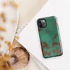 Glossy Copper Patina Storm Tough Case for iPhone — seamless oxidized copper surface with teal-green verdigris patina
