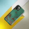 Glossy Copper Patina Storm Tough Case for iPhone — seamless oxidized copper surface with teal-green verdigris patina
