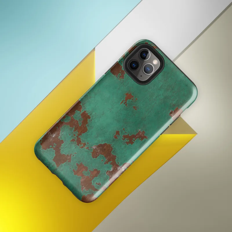 Glossy Copper Patina Storm Tough Case for iPhone — seamless oxidized copper surface with teal-green verdigris patina