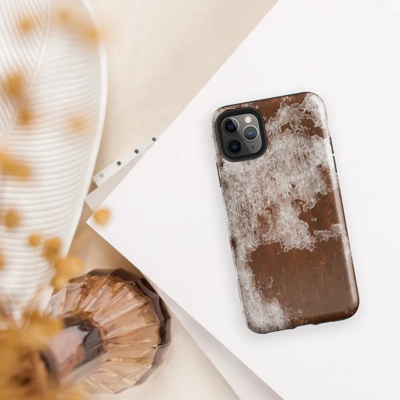 Glossy Rust and Ruin Tough Case for iPhone — peeling white paint over deep rust-red corroded iron metal surface with streaks