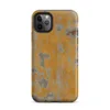 Matte Urban Decay Peeling Wall Tough Case for iPhone — aged wall with peeling amber and golden-orange paint revealing grey