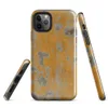 Glossy Urban Decay Peeling Wall Tough Case for iPhone — aged wall with peeling amber and golden-orange paint revealing grey