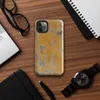 Glossy Urban Decay Peeling Wall Tough Case for iPhone — aged wall with peeling amber and golden-orange paint revealing grey