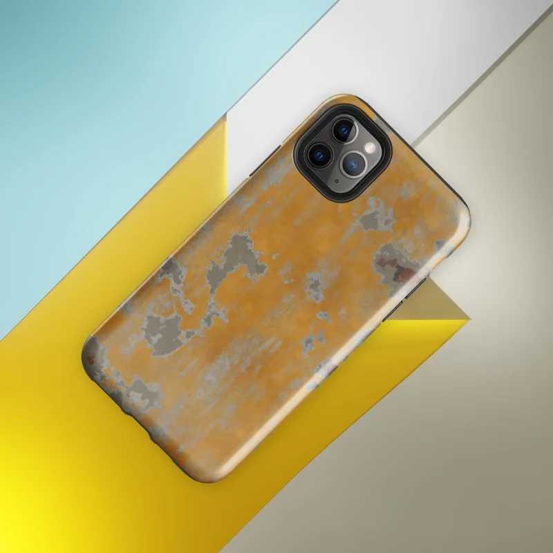 Glossy Urban Decay Peeling Wall Tough Case for iPhone — aged wall with peeling amber and golden-orange paint revealing grey