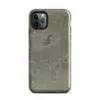 Glossy Weathered Plaster Wall Tough Case for iPhone — close-up of aged sage green plaster peeling away in irregular patches