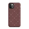 repeating ivory cross and dash marks scattered across a rich burgundy red textured background in a folk embroidery style on Matte Crimson Cross Stitch Tough Case for iPhone - default view