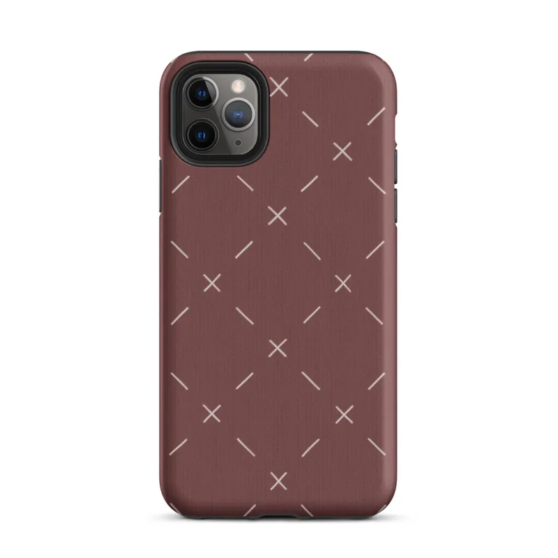 repeating ivory cross and dash marks scattered across a rich burgundy red textured background in a folk embroidery style on Matte Crimson Cross Stitch Tough Case for iPhone - default view