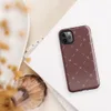 repeating ivory cross and dash marks scattered across a rich burgundy red textured background in a folk embroidery style on Glossy Crimson Cross Stitch Tough Case for iPhone - default view