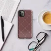 repeating ivory cross and dash marks scattered across a rich burgundy red textured background in a folk embroidery style on Glossy Crimson Cross Stitch Tough Case for iPhone - default view