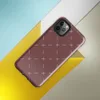 repeating ivory cross and dash marks scattered across a rich burgundy red textured background in a folk embroidery style on Glossy Crimson Cross Stitch Tough Case for iPhone - default view