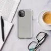 soft crinkled linen fabric texture in muted stone grey with subtle natural fiber detail and organic surface variation on Glossy Stone Linen Texture Tough Case for iPhone - default view