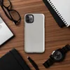 soft crinkled linen fabric texture in muted stone grey with subtle natural fiber detail and organic surface variation on Glossy Stone Linen Texture Tough Case for iPhone - default view