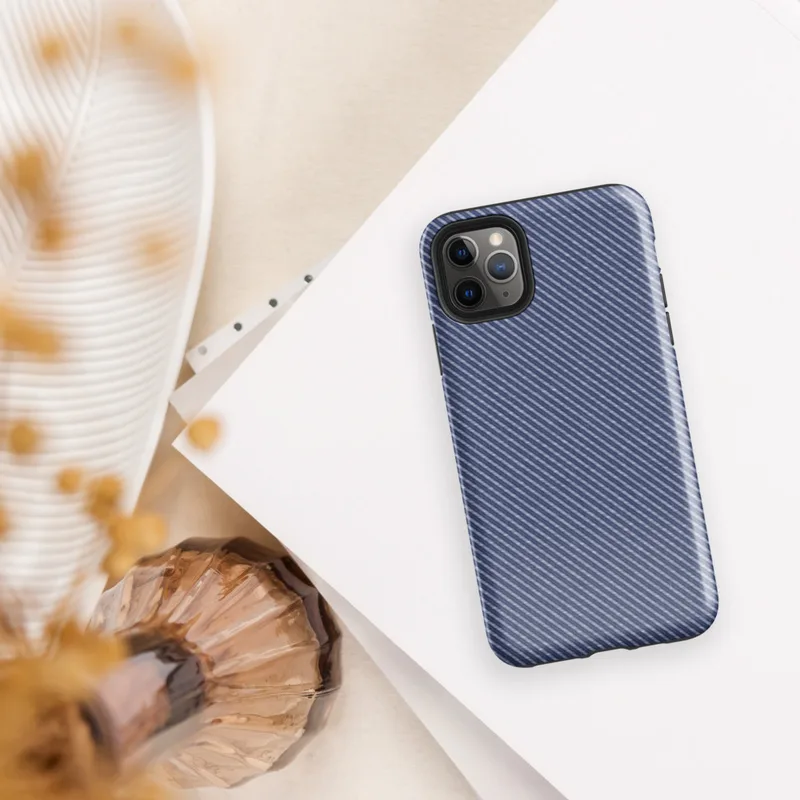 diagonal twill weave pattern in deep navy and slate blue, resembling woven fabric with fine alternating stripes on Glossy Navy Twill Weave Tough Case for iPhone - default view